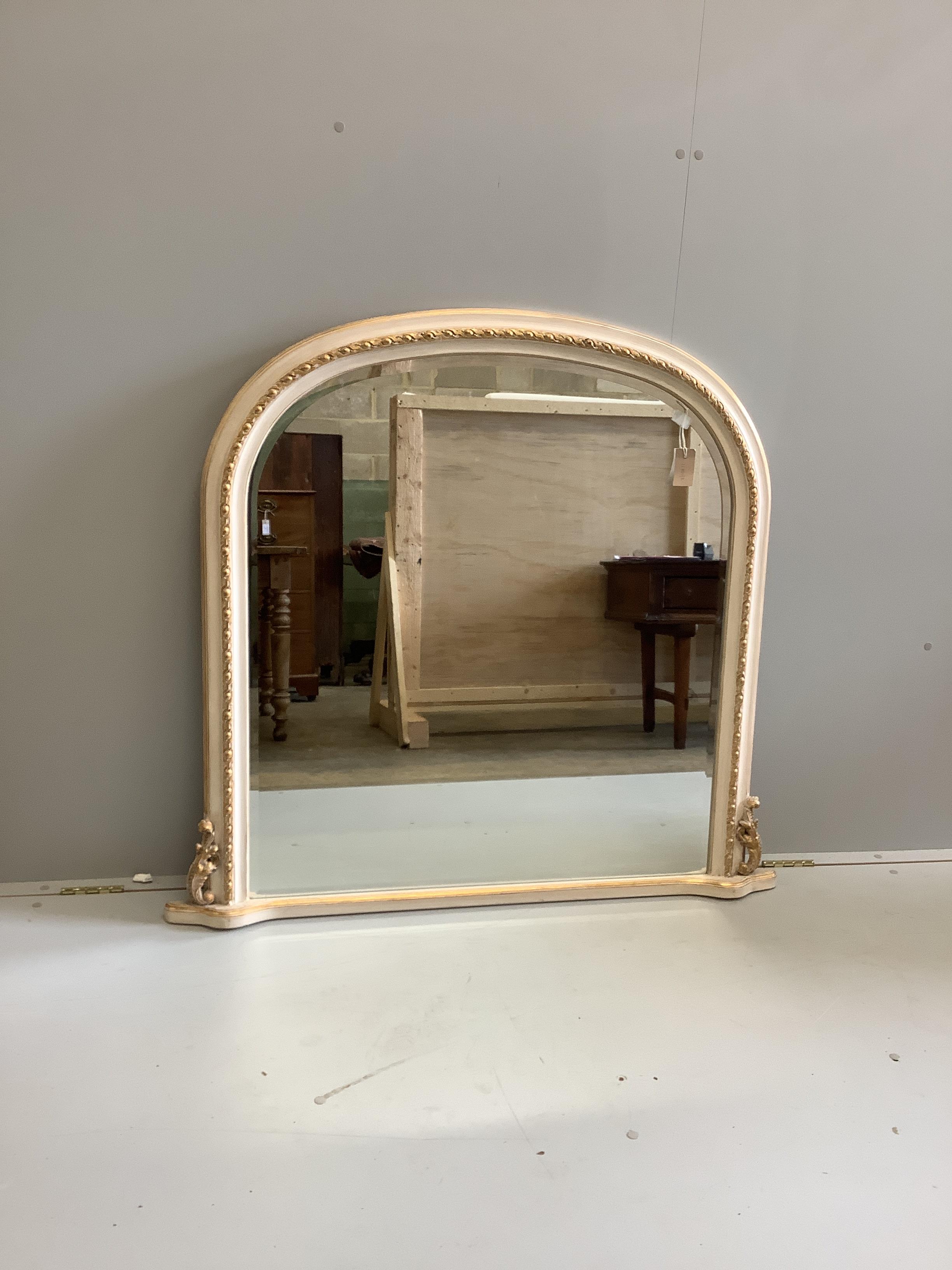 A Victorian style painted parcel gilt overmantel mirror, width 114cm, height 107cm